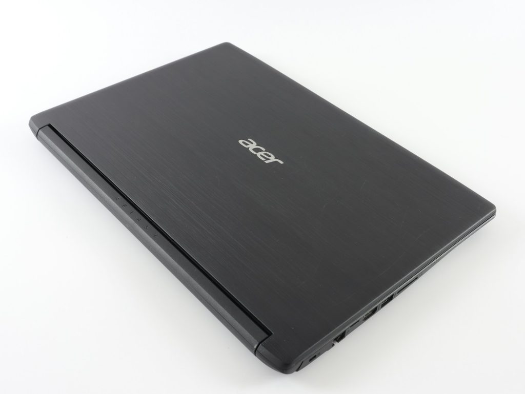 Acer laptop computer sitting on top of a white table