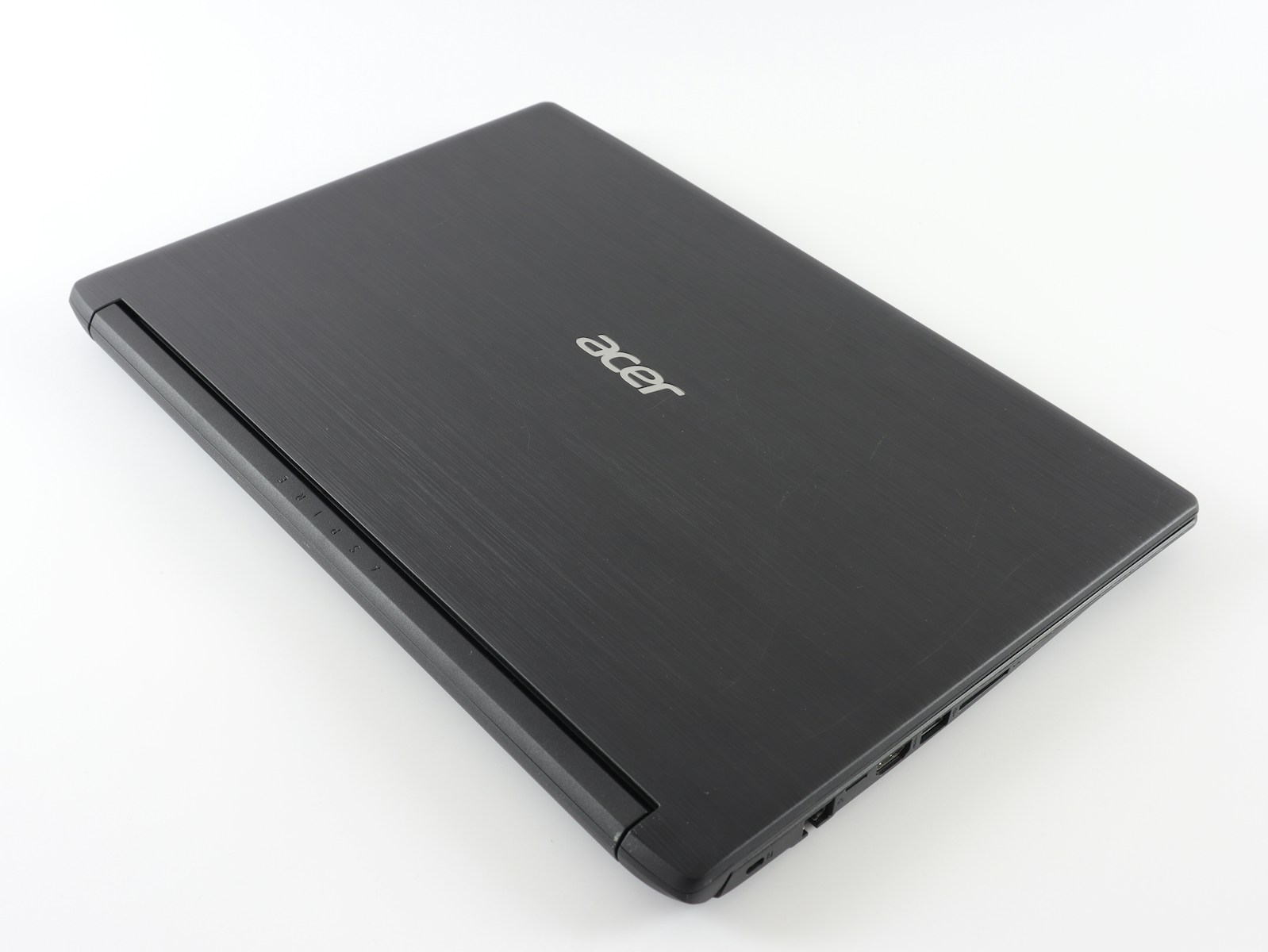 Acer laptop computer sitting on top of a white table
